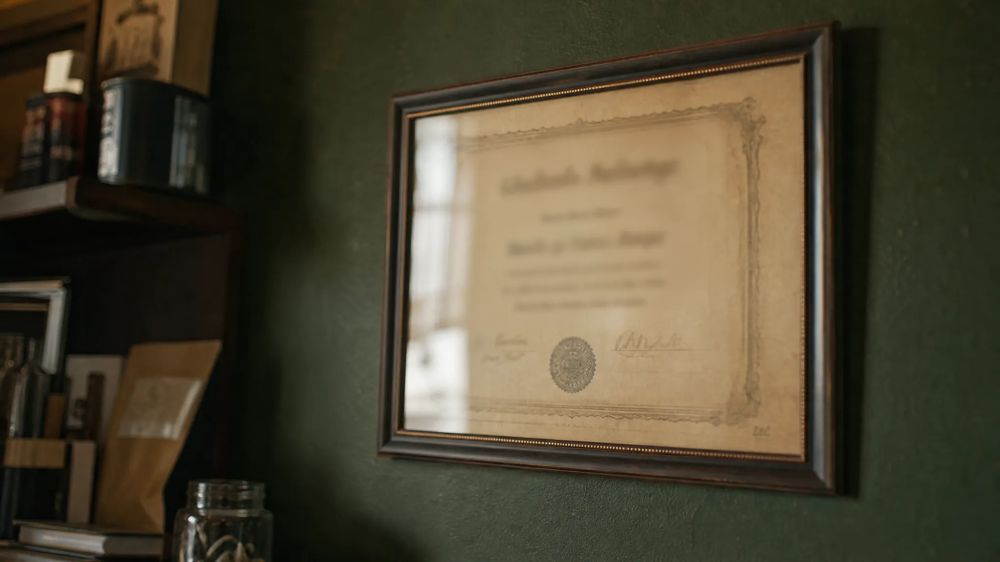 A framed business certificate on the wall of a small shop